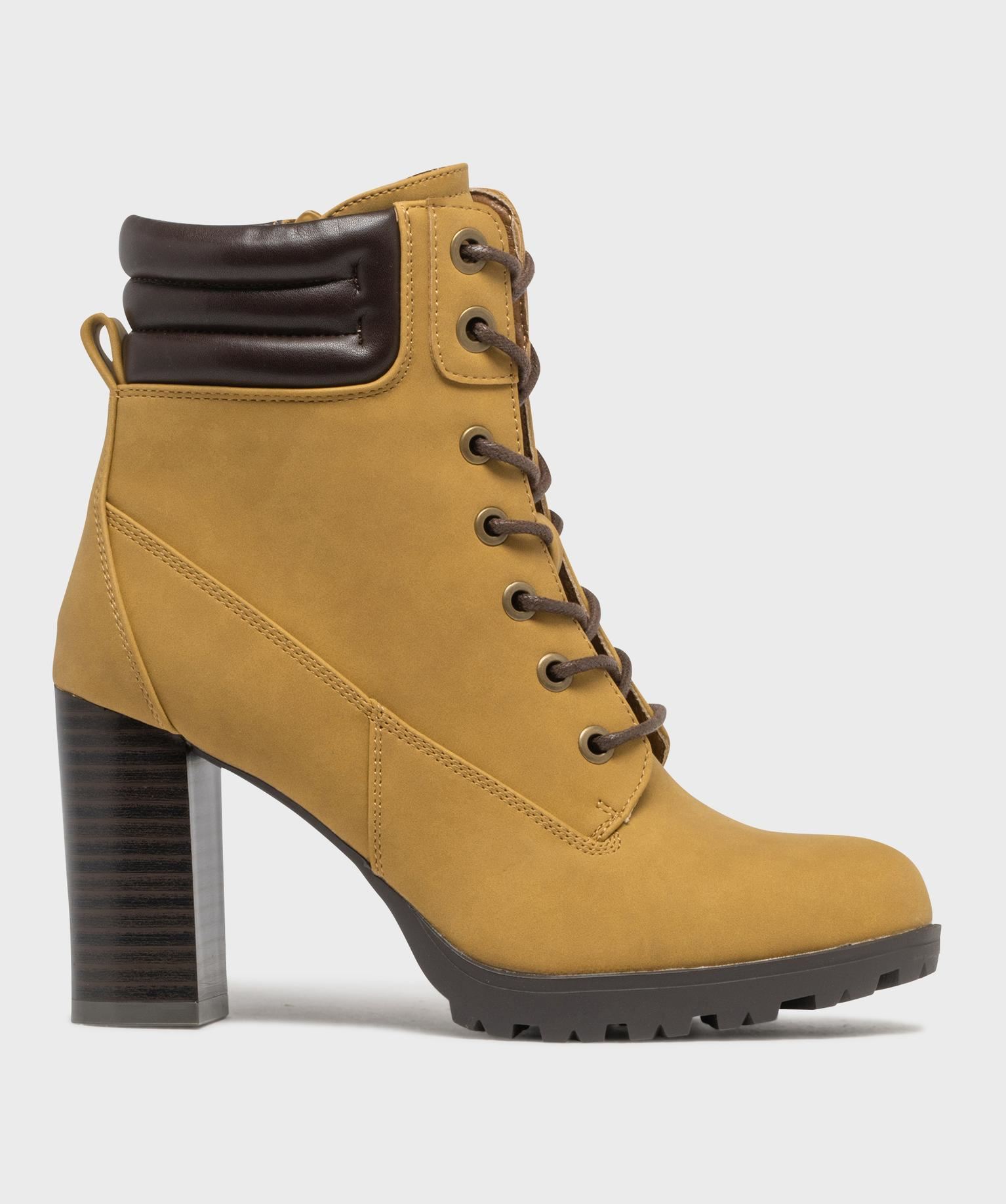 bottines femme a talon haut avec col matelasse a zip et a lacets ronds cires jaune