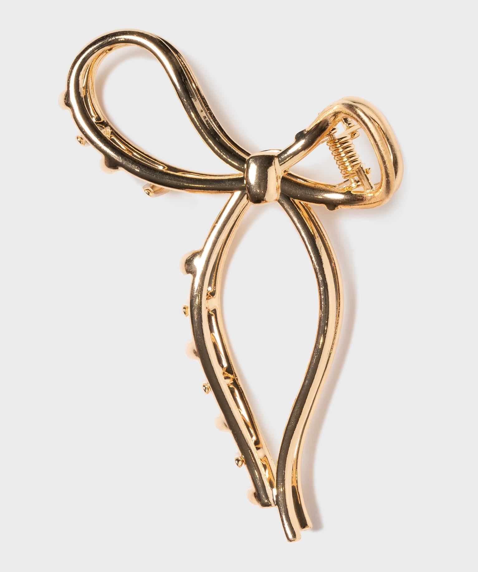 pince crabe pour les cheveux en metal en forme de noeud dore accessoires cheveux